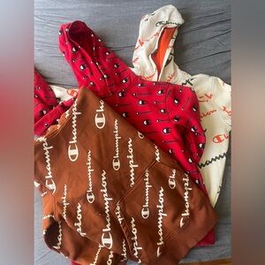 3 boys champion hoodies size medium.  Great condition. Red, brown and cream